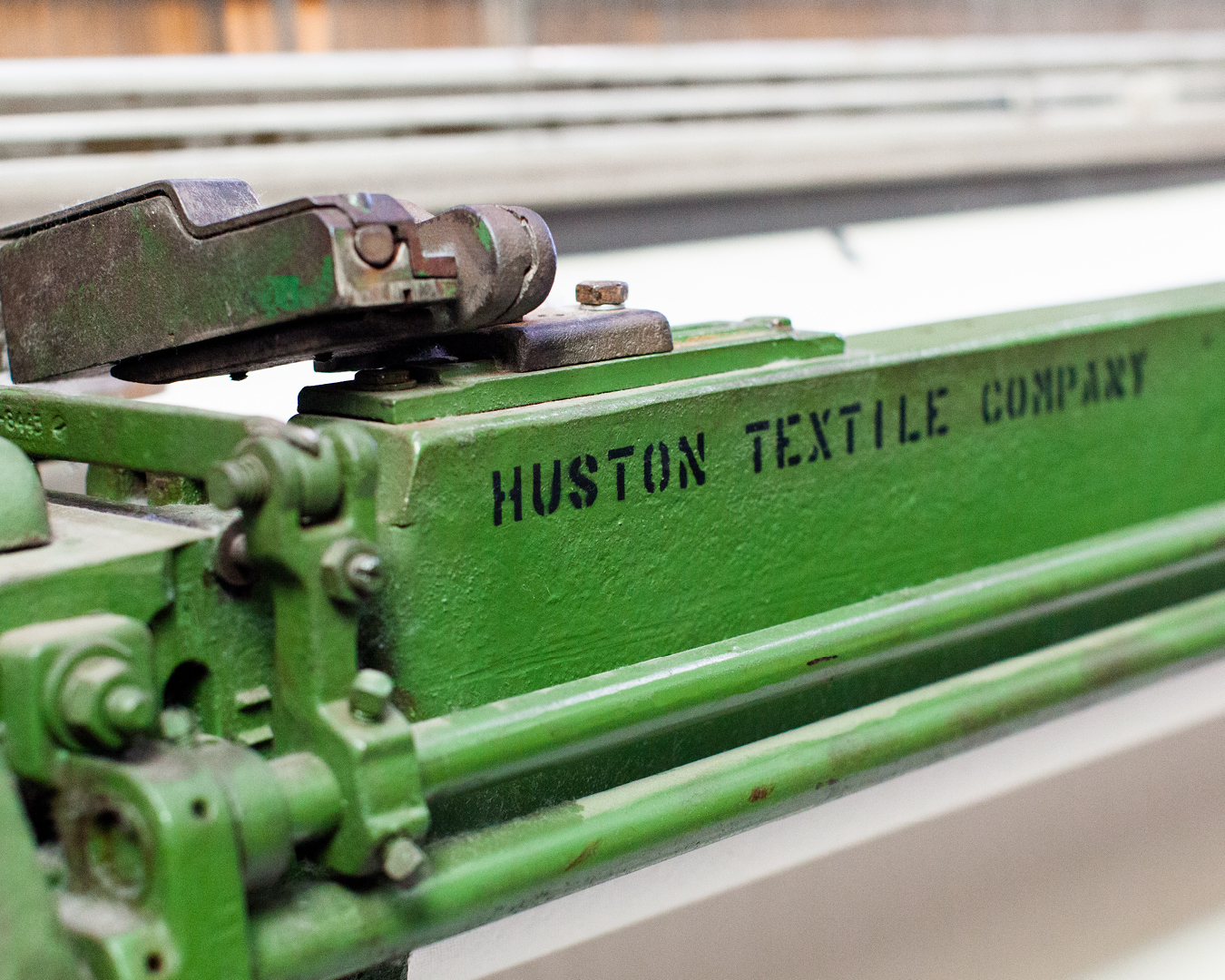 photograph-green-painted-heavy-metal-equipment-with-black-text-huston-textile-company