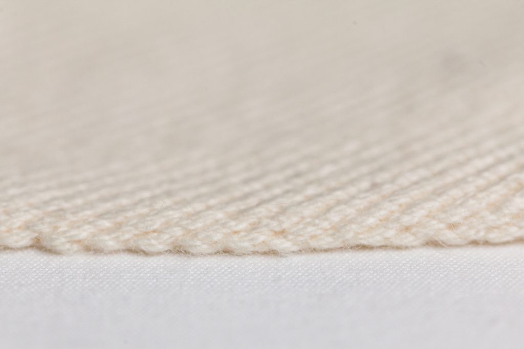 Close up detail of selvedge textile - natural organic cotton weft, Natural Organic Cotton warp, Left Hand 3/1 twill, 10oz, Width 45"