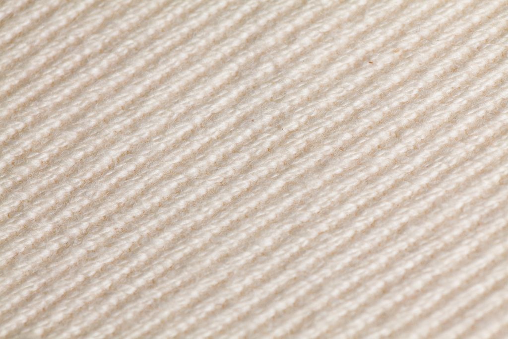 Close up detail of finished natural cotton denim swatch